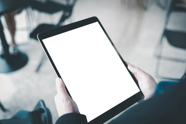 istock A woman hand showing digital tablet  blank screen on work desk. 1700118279