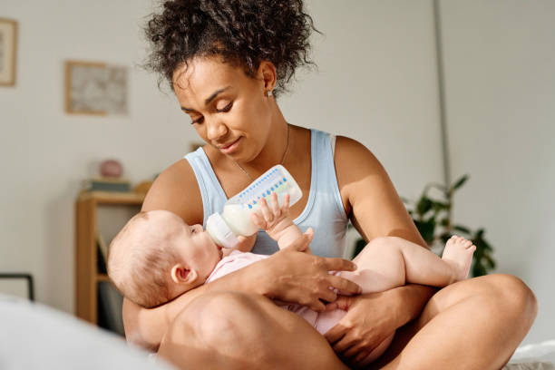 istock Young mom feeding her baby 1700119434