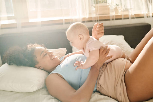 istock Happy mom enjoying time with baby 1700120531