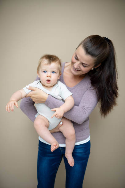 istock beautiful young mother with her baby son 1700136120