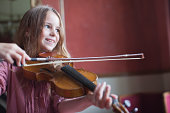 Portrait of smiling girl playing violin