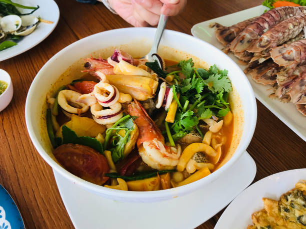 istock Thai spicy soup with seafood in Phuket, Thailand. 1700151308