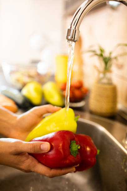 istock Washing red and green peppers 1700154134