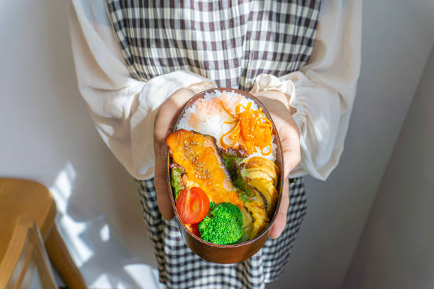 istock Woman with homemade lunch 1700159246