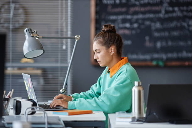 istock Woman typing on laptop in office 1700164858