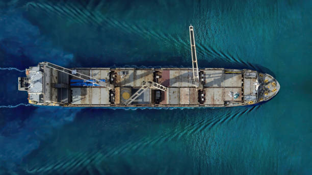 istock Industrial import-export port prepare to load containers. Aerial top view container ship in export and import global business and logistic. Global transportation and logistic business. 1700166037
