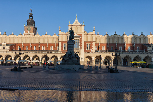 City of Krakow in Poland, Main Market Square in the Old Town at sunrise with the Cloth Hall (Polish: Sukiennice).