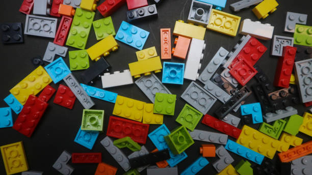 istock Plastic toy block on a black background 1700193296