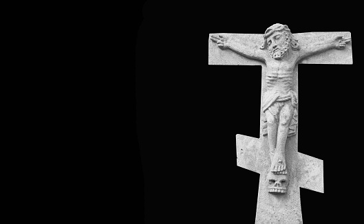 crucifixion of Jesus Christ as a symbol of resurrection and immortality of the human soul (ancient stone statue)
