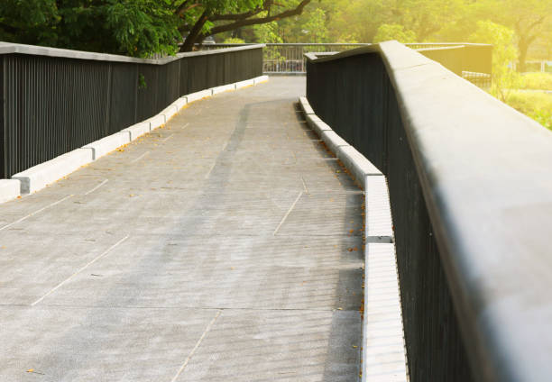 istock Concrete sky walk outdoor in the forest park with sunlight. 1700229071