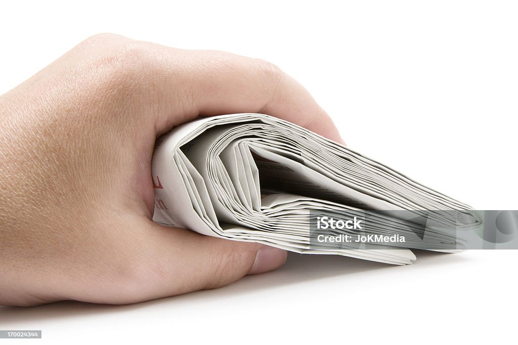Segurando um jornal dobradas - Foto de stock de Jornal royalty-free