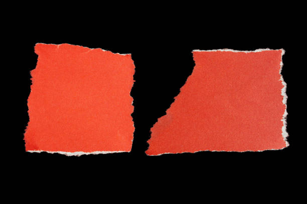 istock Ripped paper piece on isolated black background 1700245046
