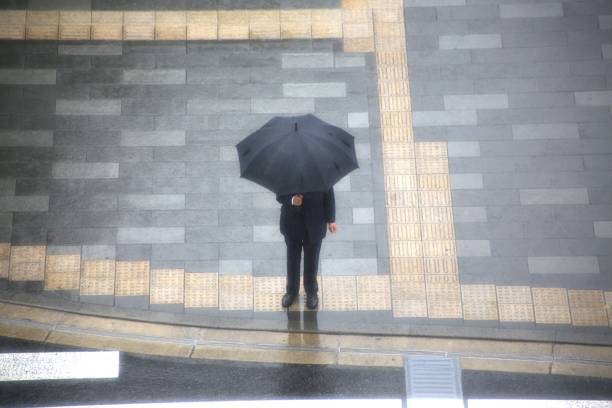 istock People walking at Tokyo Station on a rainy day 1700245256