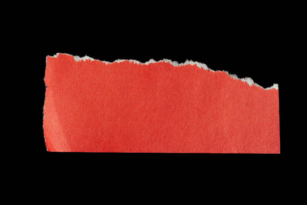 istock Ripped paper piece on isolated black background 1700245875