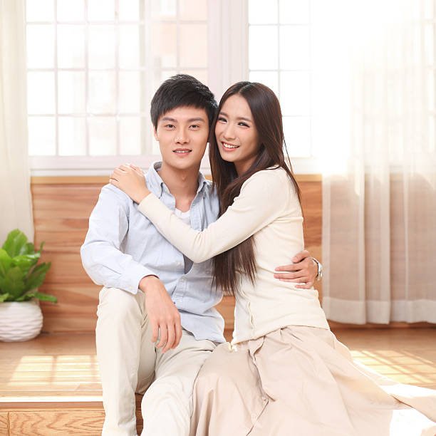 istock Smiling couple on floor in living-room 170024877