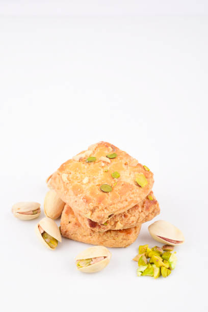 Baked nut cookies on white background, pistachio biscuit