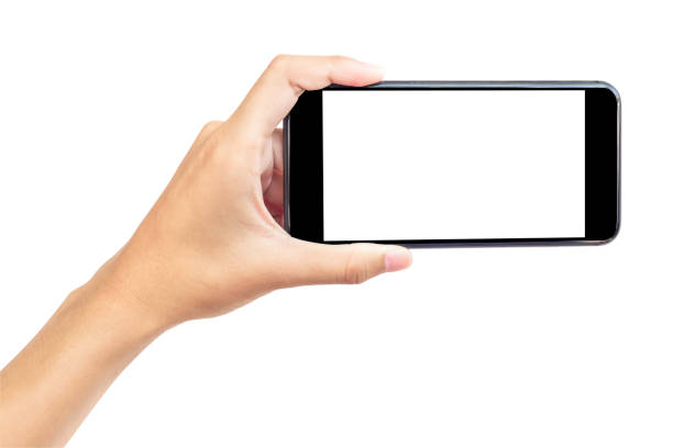 istock Hand holding mobile smart phone with blank screen. Isolated  white  background and clipping path. 1700255556