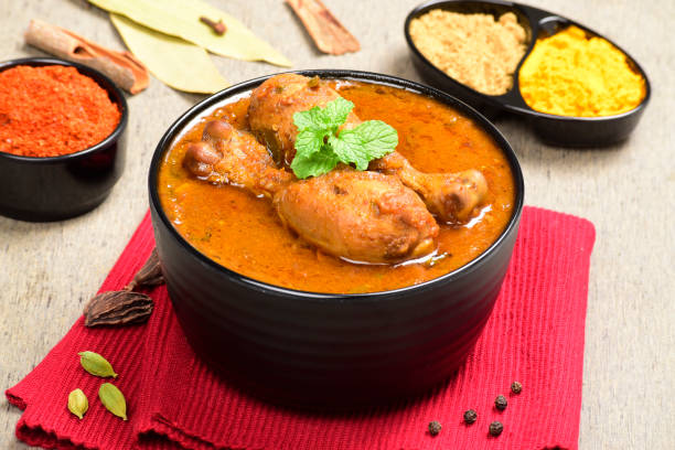 istock Indian style spicy chicken curry in bowl 1700255982
