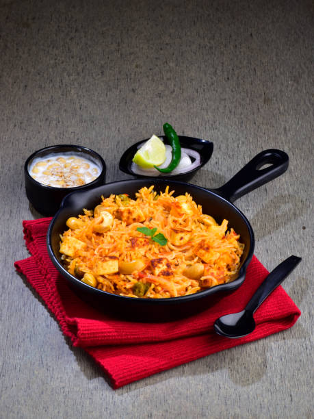 istock Paneer pulao served with raita and onion lemon 1700258788