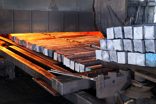 This picture was taken at a rolling mill. They  are  putting iron billets  in the oven to melt.Image has been taken in Denizli,Turkey.