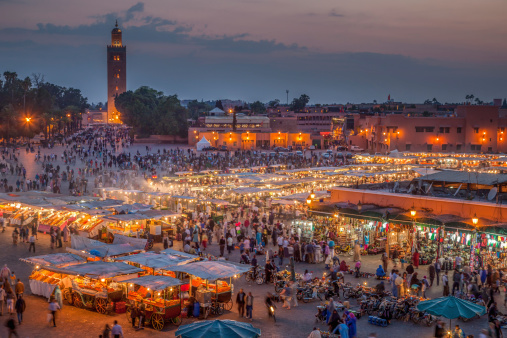 Djemma el Fna, the famous square and market place, at dusk in Marrakech, Morocco.