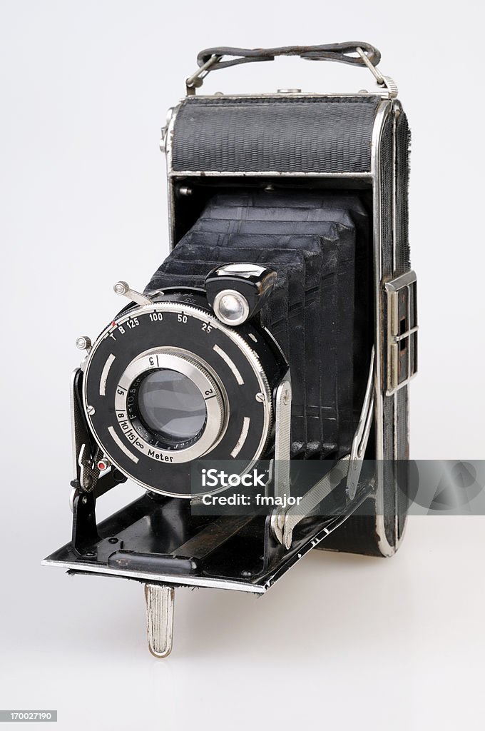 Old Camera Old camera on the white background.. Camera - Photographic Equipment Stock Photo