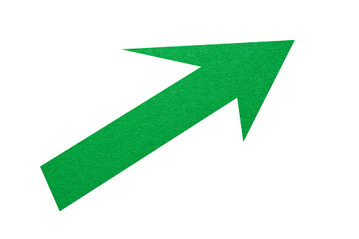 Green paper arrow sign isolated on a white background. Arrow shape with copy space.