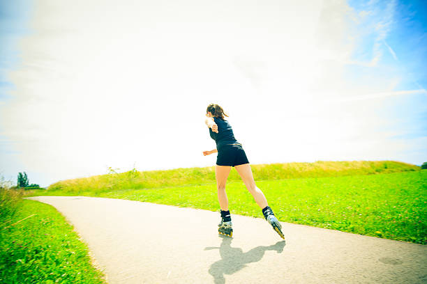 istock young woman with inline skates 170027494