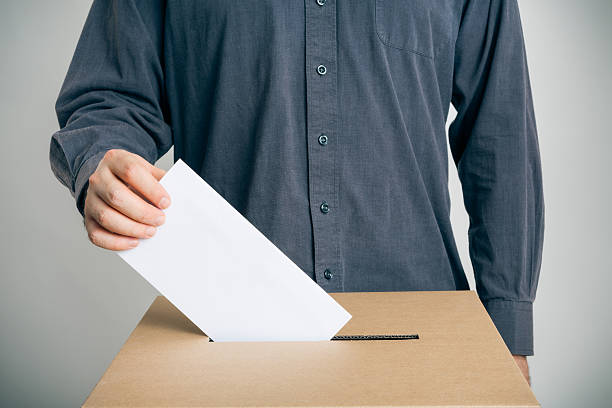 man casting his vote man casting his vote ballot box photos stock pictures, royalty-free photos & images