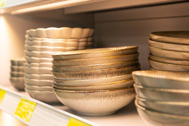 istock Shelf with ceramic plates for sell in a tableware store. 1700275595