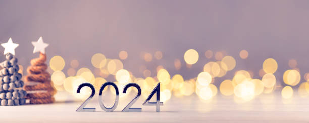 istock Metal numbers 2024 on table with bokeh lights. 1700277236