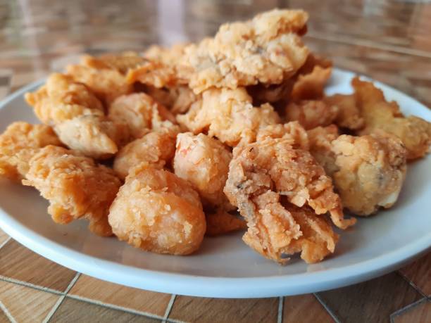 istock Crispy Fried Oyster Mushrooms On A Plate (Jamur Crispy). 1700278351