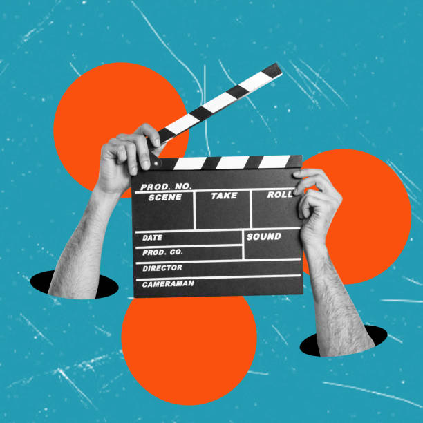istock Hands holding a clapper while shooting a video movie in a studio. A clapper for a movie production. Action. 1700283361