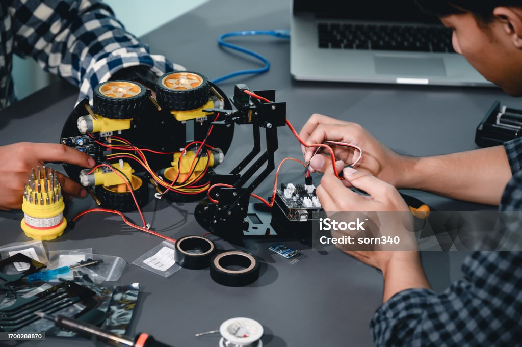 Engineering And Robotics Engineer Asian Students Assembling Robotics Kits Learning Mechanical ...