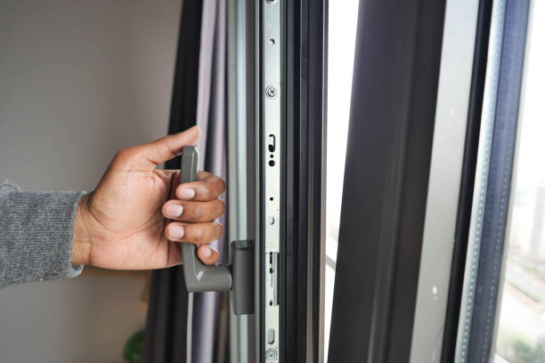 istock hand open gray plastic pvc window at home at early morning 1700304855