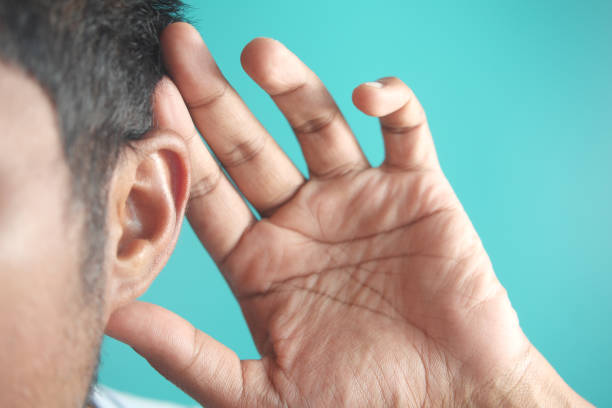 istock young man having ear pain touching his painful ear , 1700308699