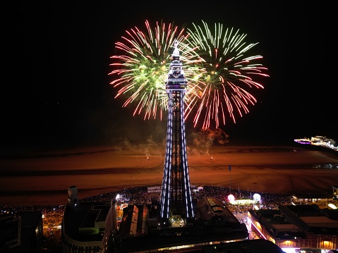 Blackpool, United Kingdom – September 16, 2023: A vibrant display of fireworks illuminating the night sky at the cityscape of Blackpool.
