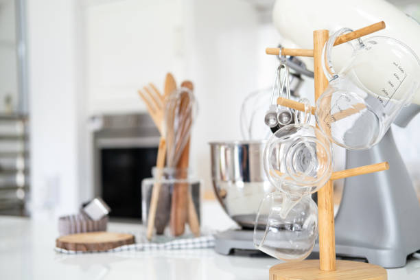 istock Kitchen utensils and wooden tools for homemade baking on a light kitchen background. Selective focus. 1700312478