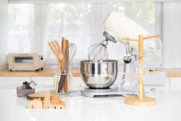 istock Kitchen utensils and wooden tools for homemade baking on a light kitchen background. Selective focus. 1700312505