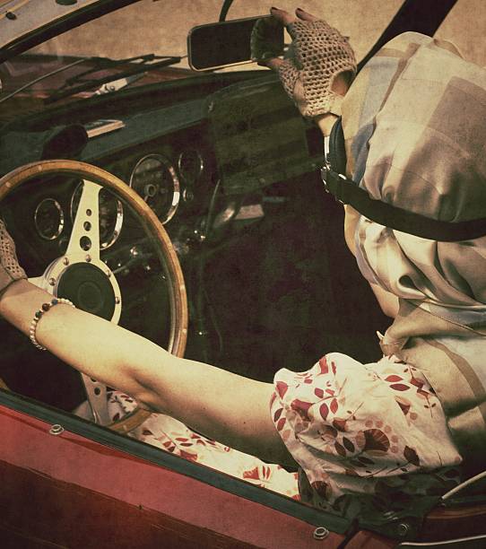 Woman in a vintage car checking her rearview mirror. Texture and age effects added.