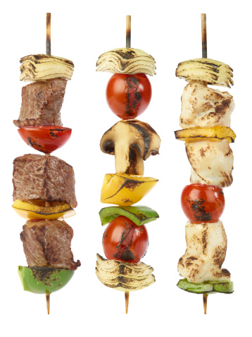 Grilled beef,, chicken and vegetable kebabs isolated on white