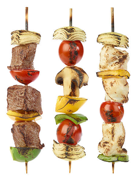 Grilled kebabs Grilled beef,, chicken and vegetable kebabs isolated on white kebab stock pictures, royalty-free photos & images