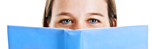 istock Pretty smiling eyes peep over blue book: reading is fun! 170031791