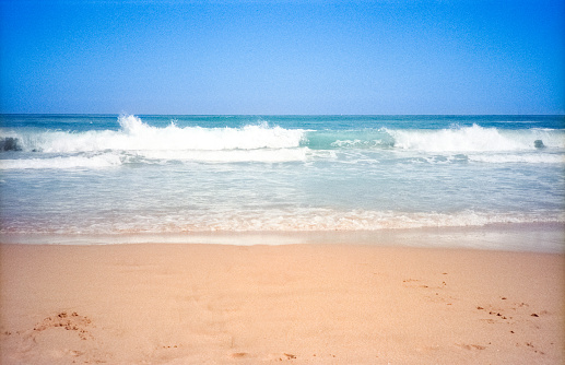 Vintage 1980s film photograph of the beach and ocean on the tropical island of Maui, Hawaii.