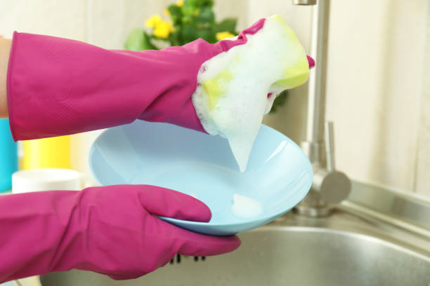 istock Concept of dishwashing on kitchen basin background 1700320078