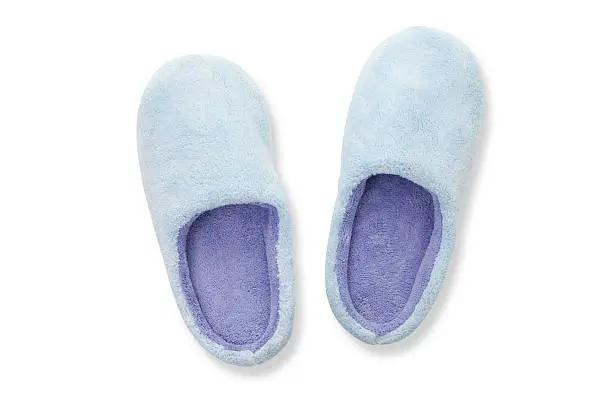 Slippers on white background, directly above