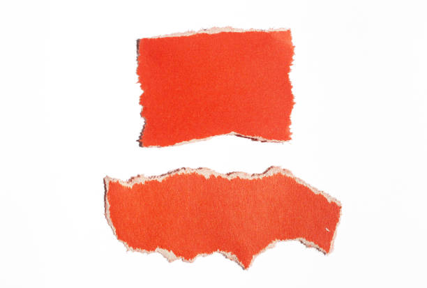 istock Ripped red paper piece on isolated white background 1700321245