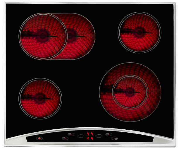 Hot electric hob Electric hob isolated on white,, rings turned on glass ceramic stove top stock pictures, royalty-free photos & images