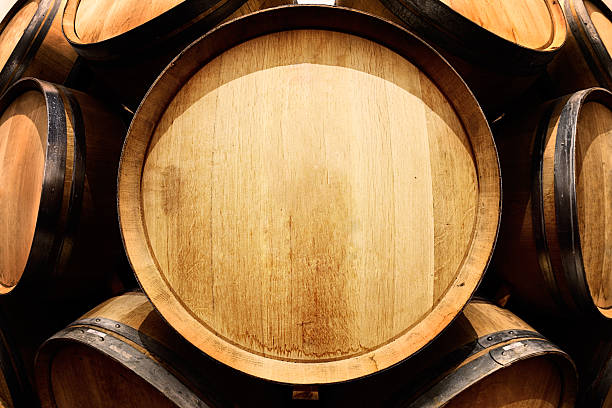 End-on view of oak wine barrel with copy space An end-on view of an oak barrel in a stack of them shot with fisheye lens which distorts them weirdly. The face of the barrel offers unusual copy-space opportunities. barrel photos stock pictures, royalty-free photos & images
