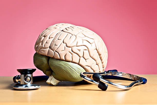 istock Psychiatry or neurology? Model brain with stethoscope 170032371